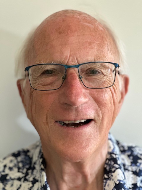 Smiling image of Dr Bill Daniels.  He is the founder of HELP Auckland and also has decided to leave a bequest in his will to HELP Auckland.